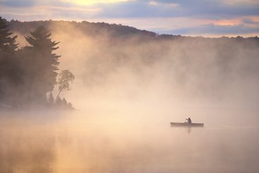 Canoe on a foggy lake