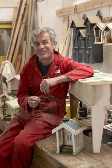 portrait of craftsman smiling in workshop