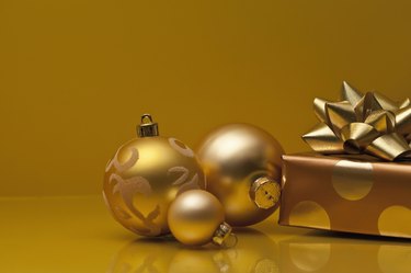 Christmas gifts wrapped in silver and gold paper