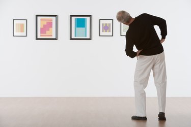 Man admiring artwork in gallery