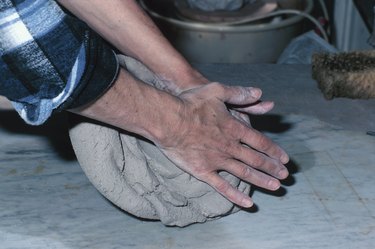 Person kneading clay