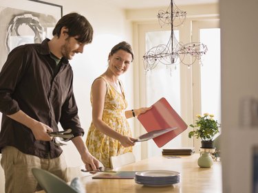 Couple setting table together