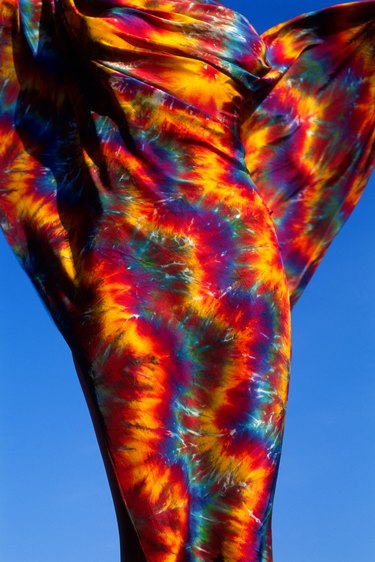 Female torso wrapped with tie dye scarf