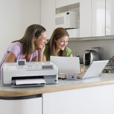 Mother and daughter printing from digital camera