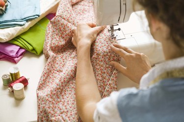 Woman using sewing machine