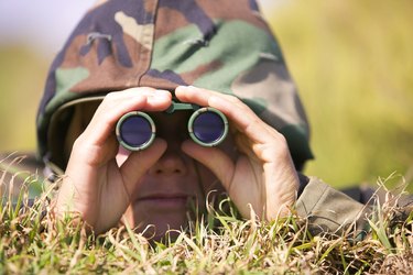 Soldier using binoculars