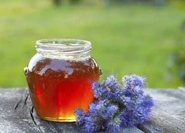 honey on wooden garden table