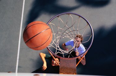 Two Teenage Boys Playing Basketball