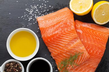 Salmon and spices on stone table. Top view