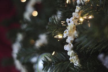 Stringing cranberries and popcorn is a fun family holiday activity.