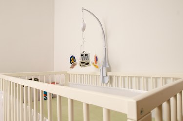 Crib and mobile in nursery