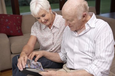 Couple looking at photo album together