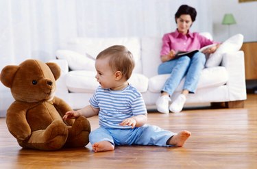 Infant Playing with a Teddy Bear