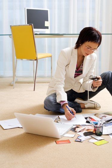 Businesswoman sitting on the floor to work