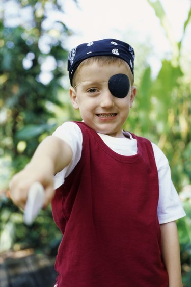 Portrait of a boy pretending to be a pirate