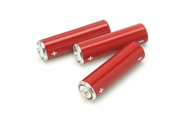 Three red AA size batteries