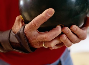 Close-Up of a Man Holding a Bowling Ball