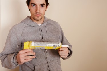 Man with caulk