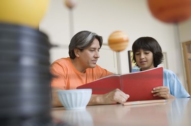 Father helping son with homework