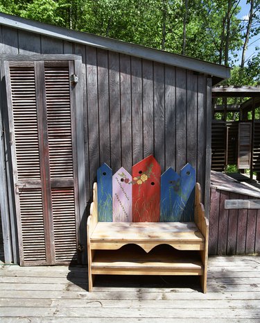 Decorative wooden bench on porch