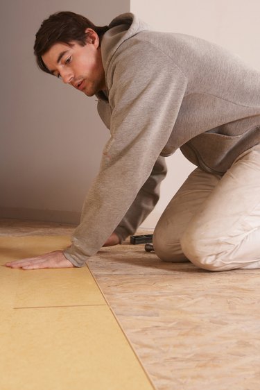 Man installing flooring