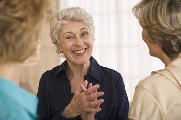 Mature woman talking with friends