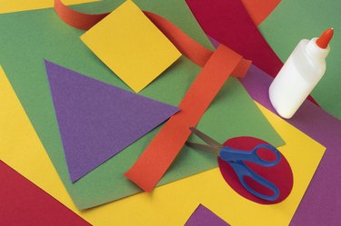 Construction paper cutouts of shapes with scissors and glue
