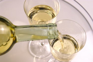 Pouring wine in to glasses, close up