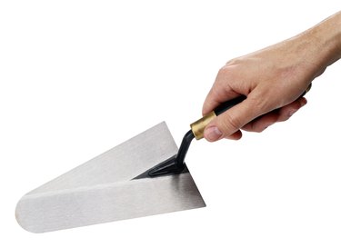 Man Holding a Trowel