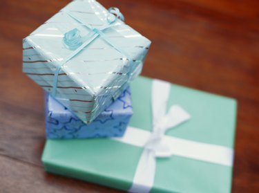 Gift boxes tied with ribbon on table, elevated view