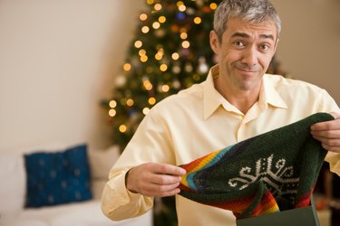 Man opening Christmas present