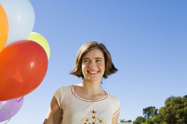 Teen girl with balloons