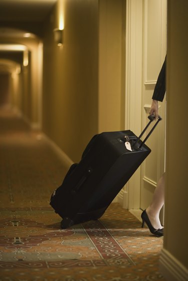 Woman pulling suitcase