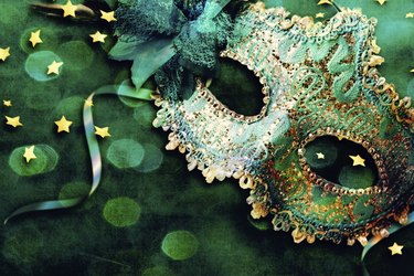 Female carnival mask with shiny background.