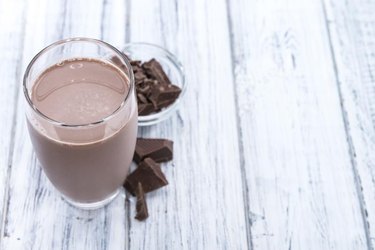 Fresh made Chocolate Milk on a bright wooden background