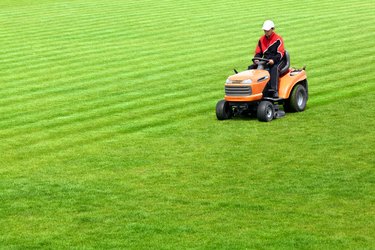 Mowing grass in stadium
