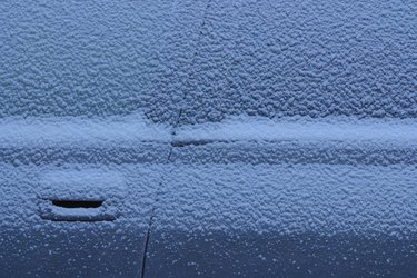 Snow-covered car close-up