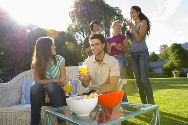 Friends snacking outdoors