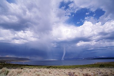 Tornado over desert lake