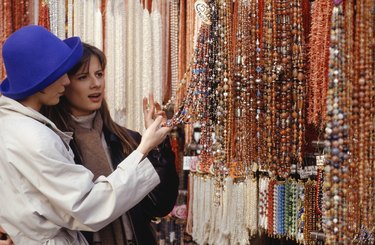 Two women shopping for necklaces