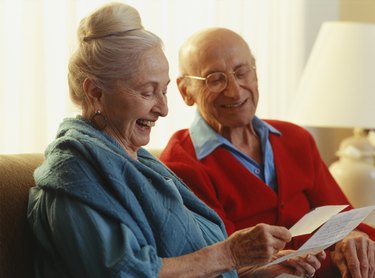 Elderly couple reading letter