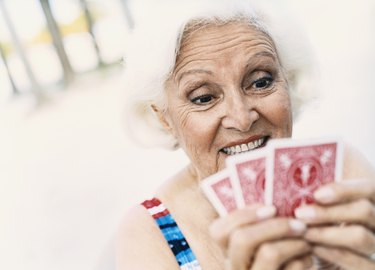Woman Looking at Her Playing Cards