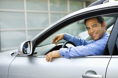 Businessman sitting in car