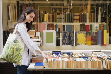 Woman shopping at secondhand bookstore