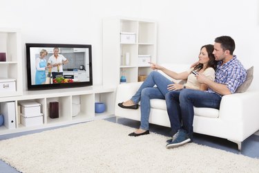 Young Couple Watching Television