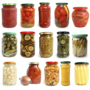 Selection of various vegetables canned in glass jars