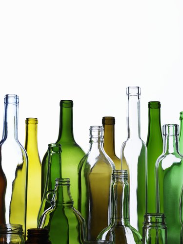 Empty glass bottles on white background