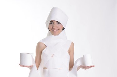 young women wrapped up economical toilet paper