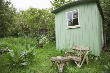 Rustic shed in lush garden