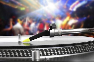dj turntable with vinyl record in the dance club